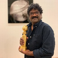  Chandrabose picks up his Goldenglobe award award 