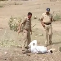 Maharashtra jalgaon police beaten a man for helping his child copy in exam