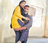 Father carried his daughter on shoulders to exam hall