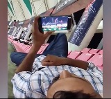 Man Watches IPL Match On His Phone Inside Cricket Stadium