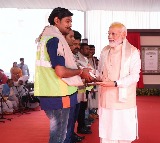 PM Modi felicitates workers involved in making of new Parliament House