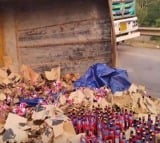 Van loaded with beer cases overturned on road