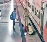 Female constable saves woman who fell on platform while getting down from train in warangal station