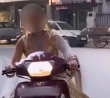 A video of a bride riding a scooter without a helmet had gone viral