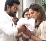 Ramcharan and Upasana before media with new born baby