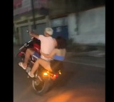 Couple falls off bike while performing dangerous stunts Delhi Police tweets video