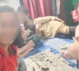 UP cop in trouble after wife children take selfie with bundles of Rs 500 notes
