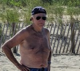 Joe Biden shirtless with baseball cap and aviators