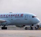 Air Canada passengers refused to sit on vomit covered seats asked to get off