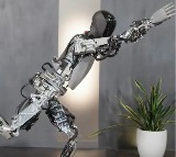 Musk showcases Tesla humanoid robot performing Yoga