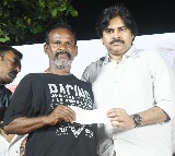 Pawan Kalyan distributes cheques to fishermen who lost boats in fire accident