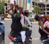Man Driving Scooter And 2 Girls Playing Holi On It In Noida
