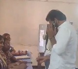 YCP candidate Duvvada Srinivas cast his vote while talking in mobile