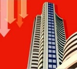 Sensex, Nifty trade flats; Midcap index slips over 300 points