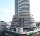 Sensex, Nifty close flat after touching all-time high