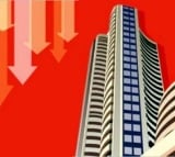 Sensex trades flat on mixed global cues