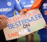 Siraj gifts a placard to Bumrah after winning world cup final