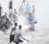 video shows people mistreating a woman during rain and causing a ruckus under the Taj Hotel bridge