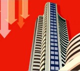 Indian stock markets end marginally low on a high volatile day