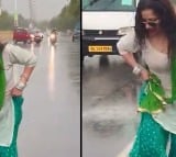 a woman dancing in the middle of a busy road and UP Cops reacted on this