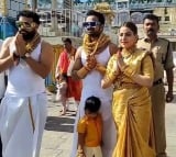 Devotees with heavy gold at Tirumala temple