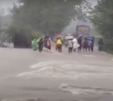 TGRTC bus struck in flood water in Warangal district