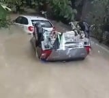 Two Cars Swept Away In Floods