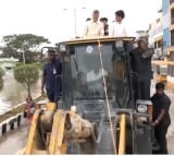 CM Chandrababu reached flood hit areas by JCB