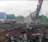 HYDRAA demolishes illegal structures in 20 acres Govt land in Ameenpur