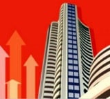 Sensex closes up by 144 points ahead of TCS Q2 results