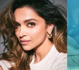 Deepika holds daughter Dua in her arms as they jet off for a family vacation