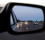 why are objects in a cars side view mirror closer than they appear