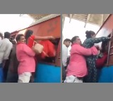 Coolie Hoists Passengers Into Train Coach Through Window