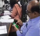 DRO Malola Playing Online Rummy In Collectorate Meeting
