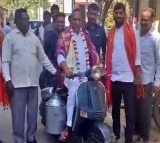 Former minister Malla Reddy ride scooter