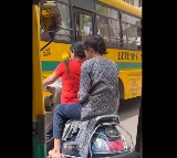 Woman Rides Helmetless With Parrot