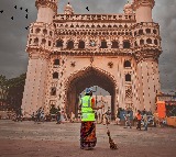 GHMC officer washes feets of sanitation worker