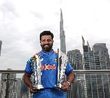 Rohit Sharma poses with his two ICC silverware in Dubai after Champions Trophy triumph
