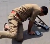 Drunk UP Police Constable Falls on Road with Gun Viral Video