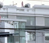 Woman Climbs AIG Hospital Building in Suicide Threat Over Job Termination