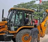 Moragudi villagers demolish accused Rahmatullas house