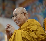 Braving heavy monsoon rain, thick fog, people attend Dalai Lama's 90th birthday celebrations