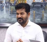 Revanth Reddy Compares KCR to Trump at Delhi Forum