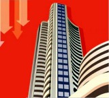 Sensex, Nifty end lower amid volatile trade