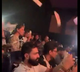 Upasana whistles throws papers during Ram Charans Peddi show