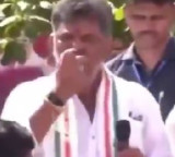 DK Shivakumar throws half eaten apples at people netizens angry