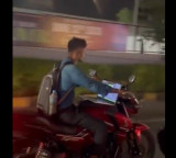 Working on laptop while riding a bike Sajjanar warns by sharing video