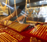 Gold prices fell by as much as 28 percent from record levels