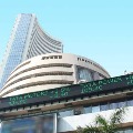 Sensex ends 129 points lower