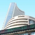 Sensex closes 329 points high